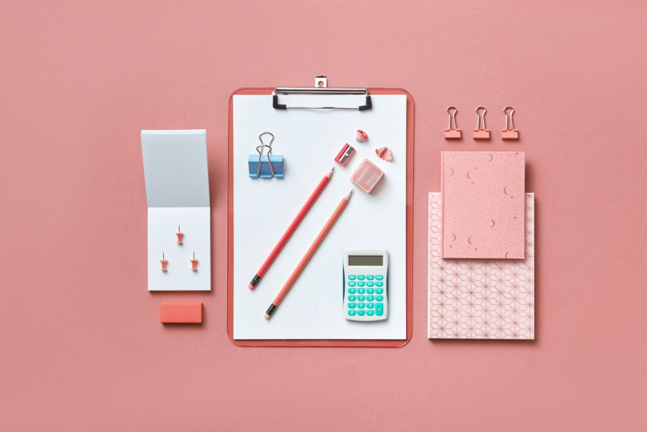 Wedding planner working on clipboard with timelines