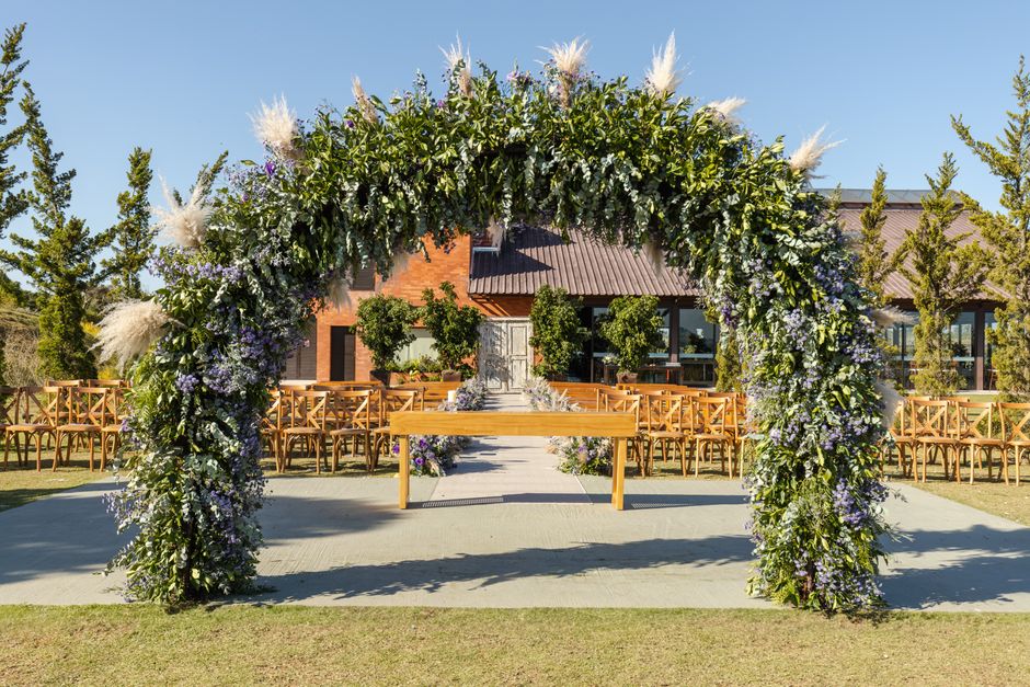 Outdoor wedding ceremony arch set up by wedding planner